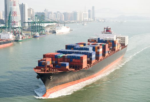 Large container ship arriving in port.